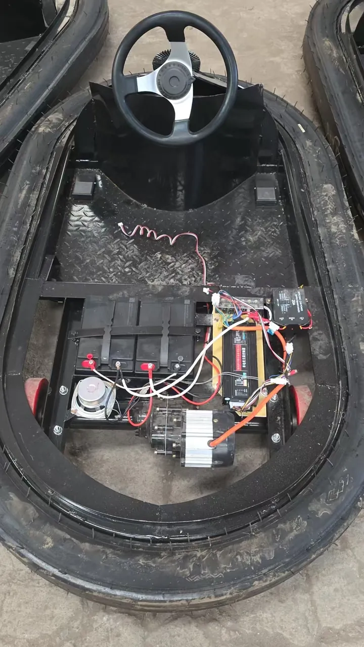 Inside a battery bumper car: battery pack, 500W motor and controller mounted on the steel chassis