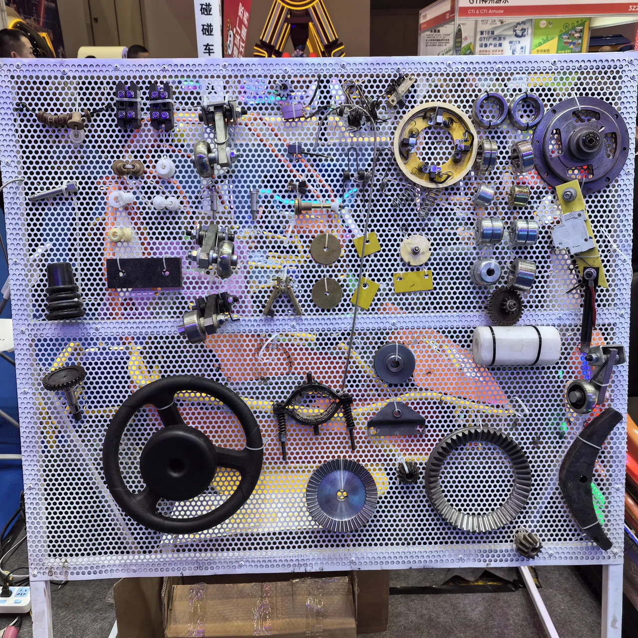 Bumper car spare parts display: steering wheels, gears, brushes, controllers and boards