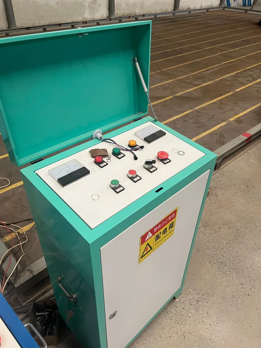 Control cabinet converting mains AC to low-voltage DC for a bumper car arena