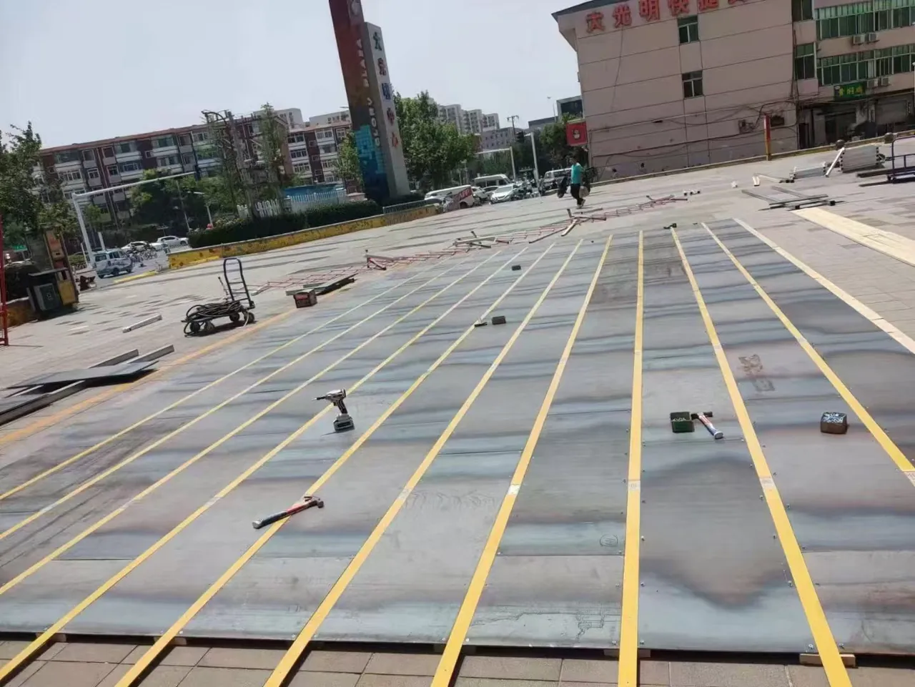 Conductive steel floor strips being assembled for a floor-grid bumper car arena