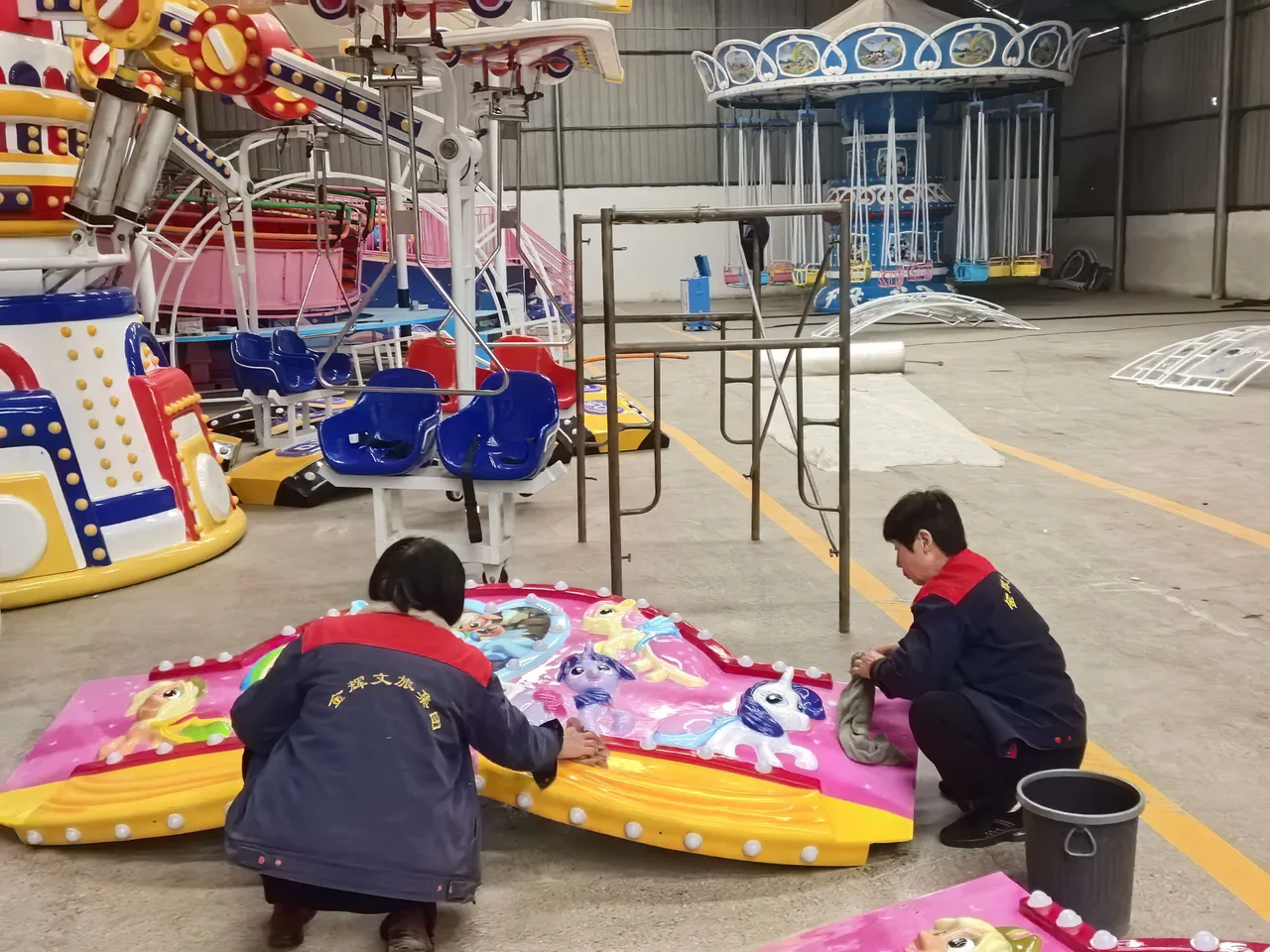 Final detailing before the canopy goes on — every raised ornament is polished by hand so the paint sits evenly.