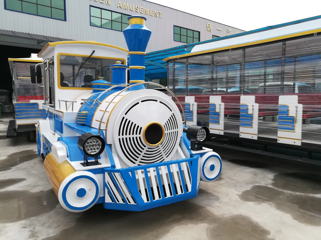 Diesel sightseeing train parked at the factory before loading